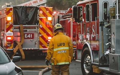 Emergency Management with a firefighter and a fire truck.