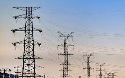 Utility Poles with a power line running through them.
