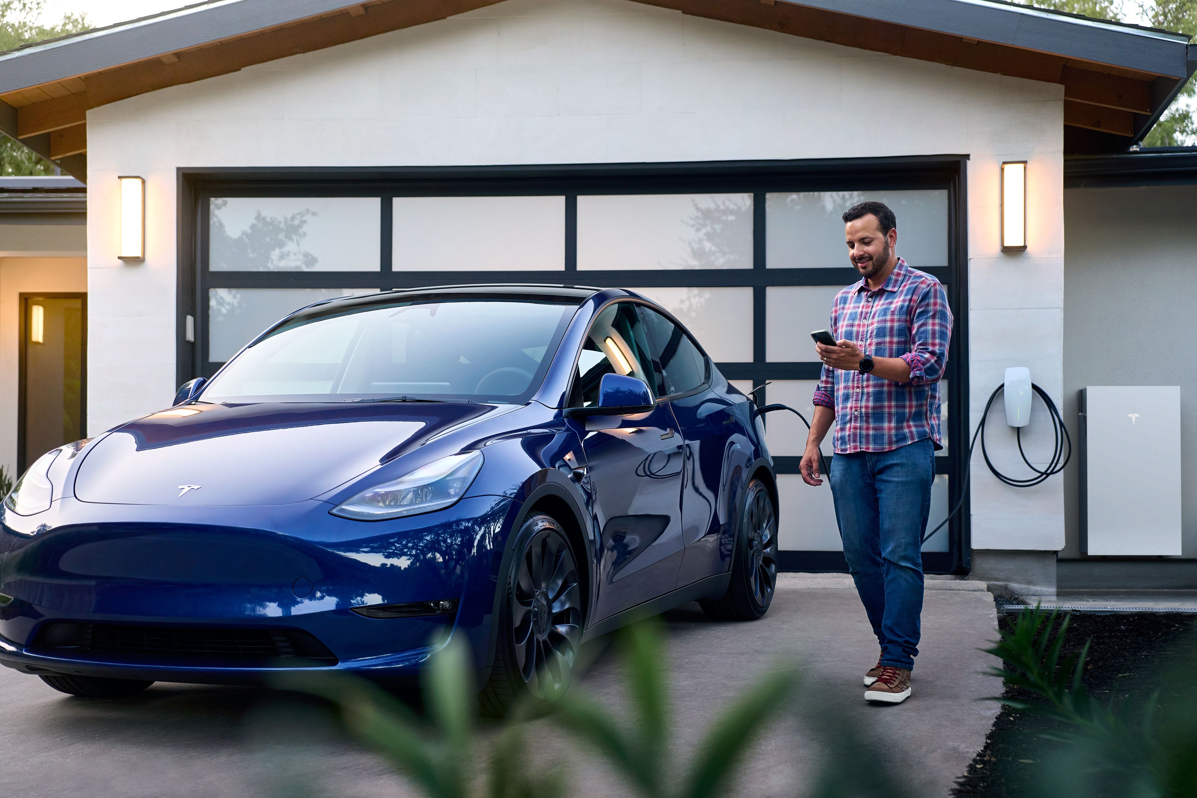 A person charging an EV