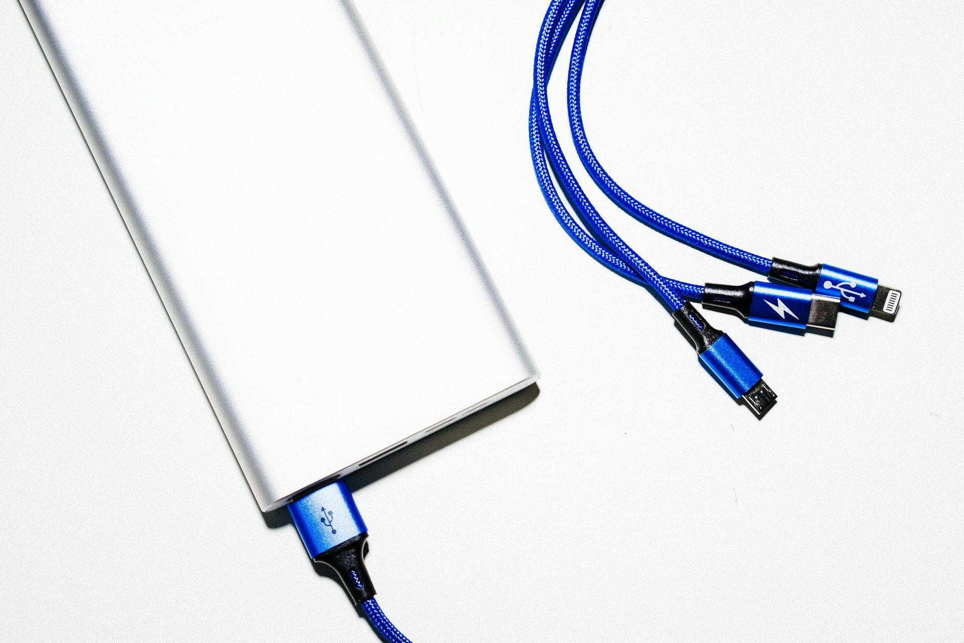 Photo of a usb power bank with charging cords