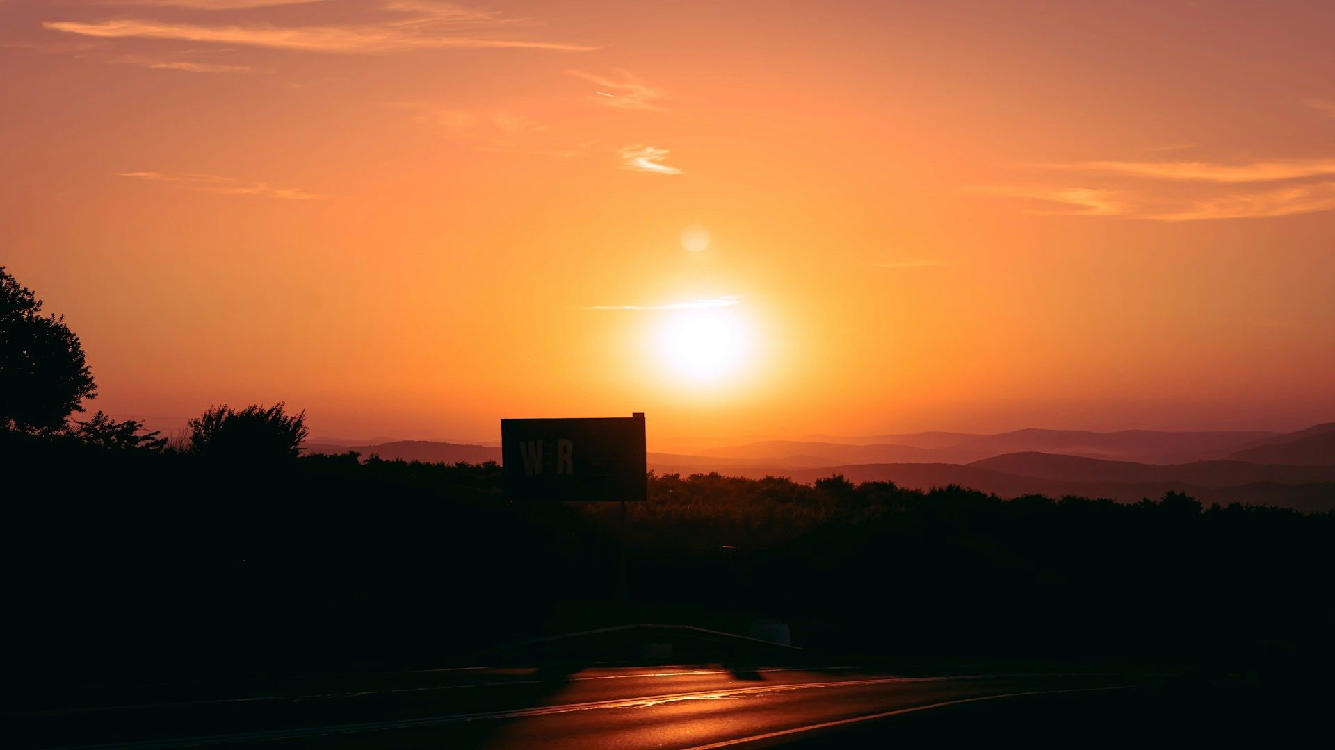 The sun over a building in a heat wave