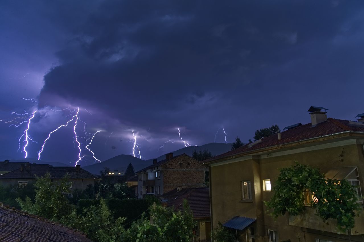Lightning storm over houses