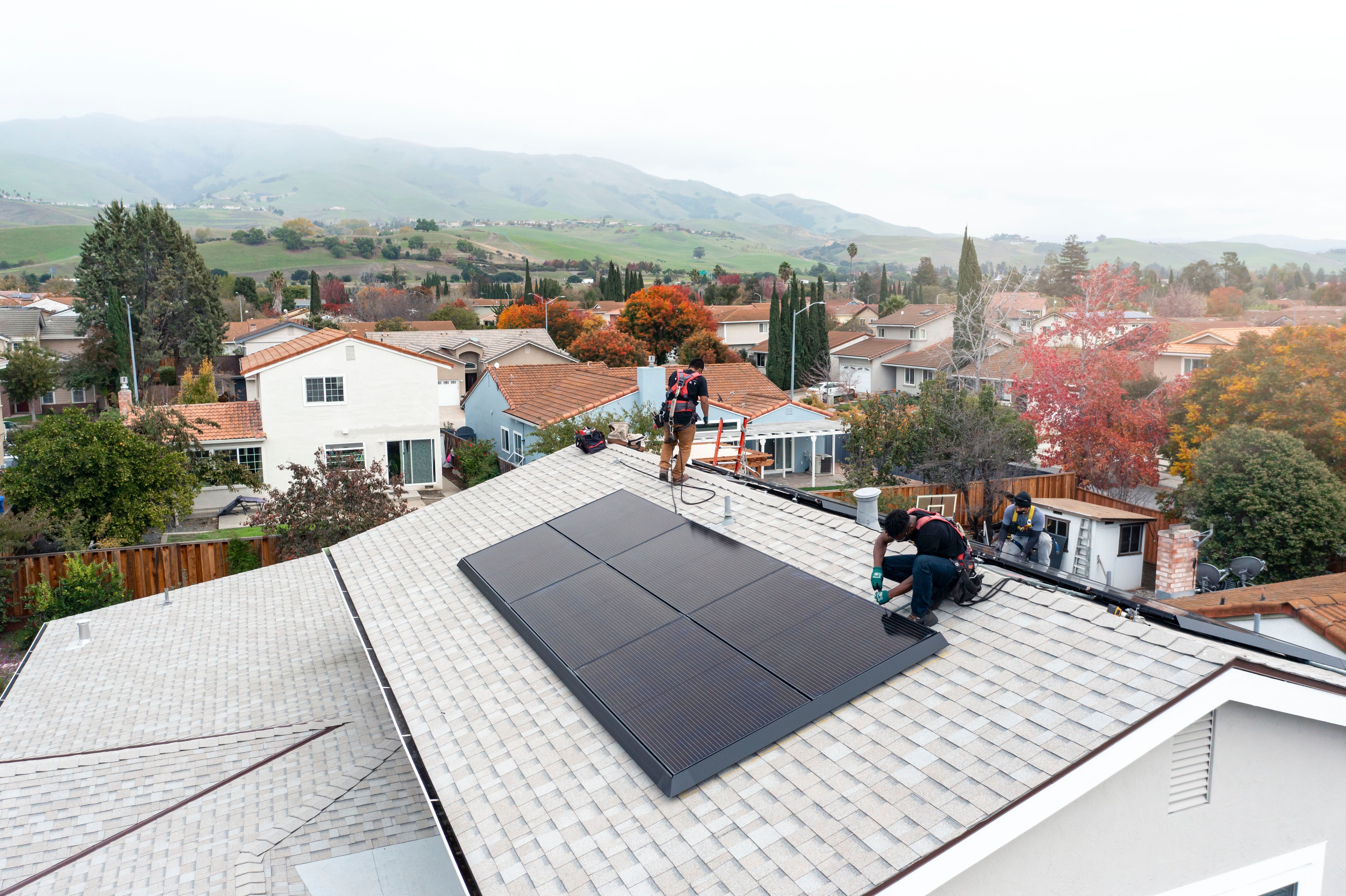 Solar panel being installed on a roof